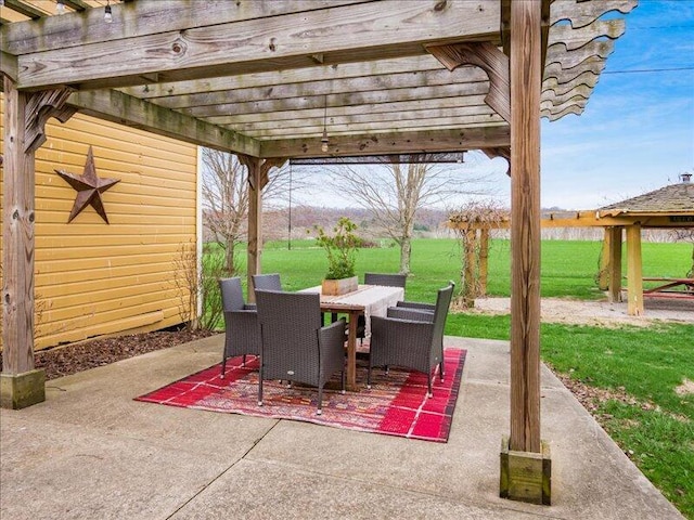 view of patio / terrace featuring a pergola and outdoor dining space