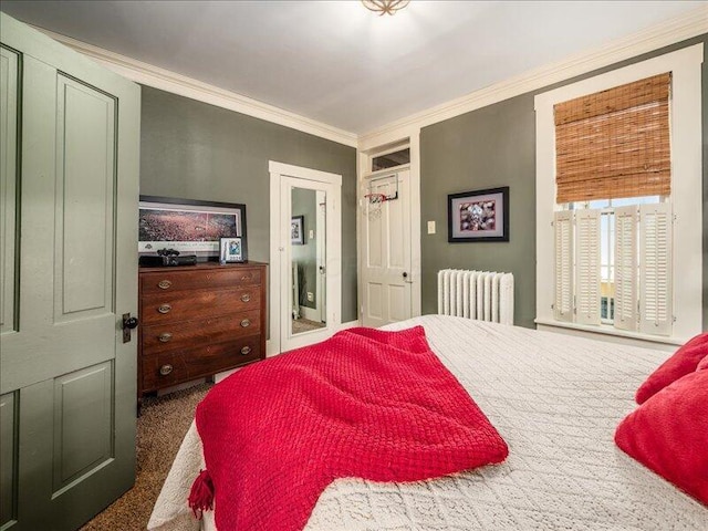 carpeted bedroom featuring radiator heating unit and crown molding