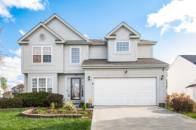 3073 Kola Way, Columbus, OH 43219 - view of front facade featuring roof with shingles, driveway, and a garage