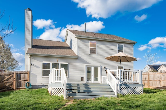 3073 Kola Way, Columbus, OH 43219 - back of property with a chimney, french doors, a fenced backyard, a wooden deck, and a yard