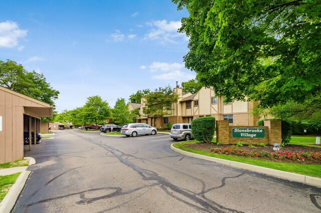 view of street featuring curbs and a residential view