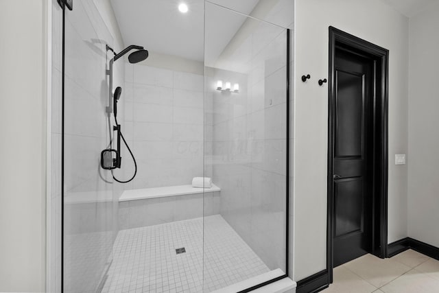 225 John H Mcconnell Blvd Unit 705, Columbus, OH 43215 - bathroom featuring tile patterned flooring, baseboards, and a stall shower