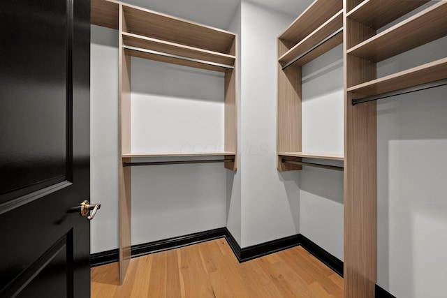 225 John H Mcconnell Blvd Unit 705, Columbus, OH 43215 - walk in closet featuring wood finished floors
