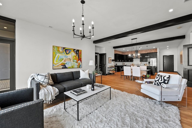 225 John H Mcconnell Blvd Unit 705, Columbus, OH 43215 - living room with wood finished floors, an inviting chandelier, and recessed lighting