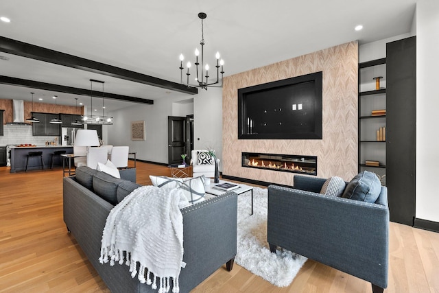 225 John H Mcconnell Blvd Unit 705, Columbus, OH 43215 - living room featuring a chandelier, light wood-style flooring, a large fireplace, and recessed lighting