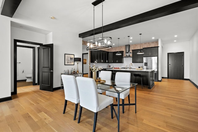 225 John H Mcconnell Blvd Unit 705, Columbus, OH 43215 - dining space with baseboards, recessed lighting, a chandelier, and light wood-style floors