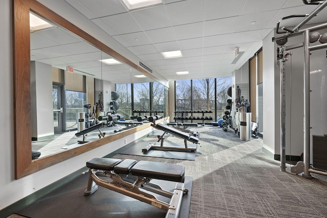 225 John H Mcconnell Blvd Unit 705, Columbus, OH 43215 - exercise room featuring expansive windows, a paneled ceiling, baseboards, carpet floors, and visible vents
