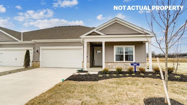 view of front facade featuring an attached garage, driveway, stone siding, and covered porch