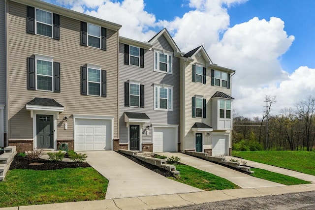 858 Blackcomb Dr, Cincinnati, OH 45244 - townhome / multi-family property featuring an attached garage, driveway, and brick siding