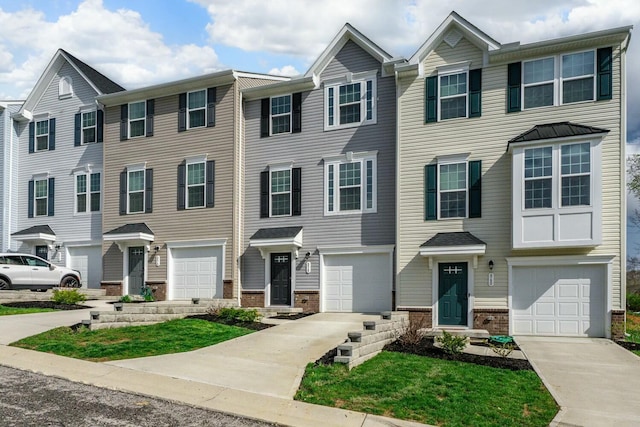 858 Blackcomb Dr, Cincinnati, OH 45244 - townhome / multi-family property featuring an attached garage, driveway, and brick siding