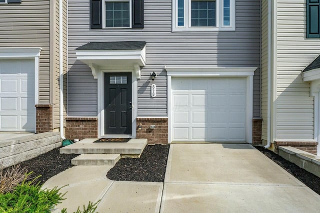 858 Blackcomb Dr, Cincinnati, OH 45244 - entrance to property with brick siding, driveway, and an attached garage