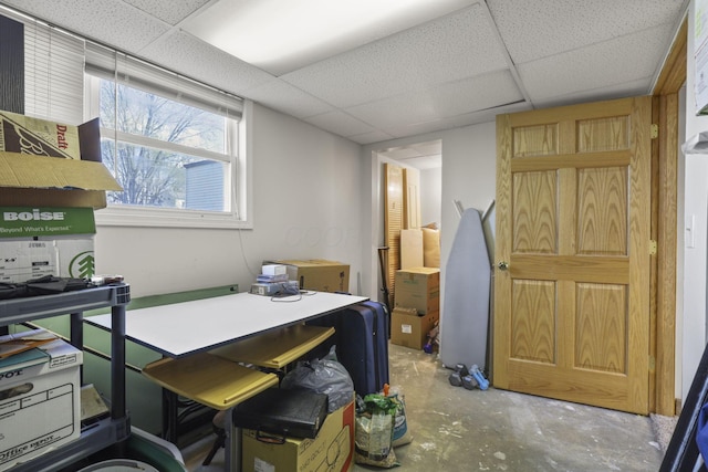 office space featuring concrete floors and a drop ceiling