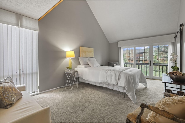 carpeted bedroom with access to exterior and high vaulted ceiling