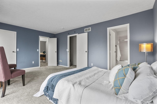 bedroom with visible vents, baseboards, and carpet