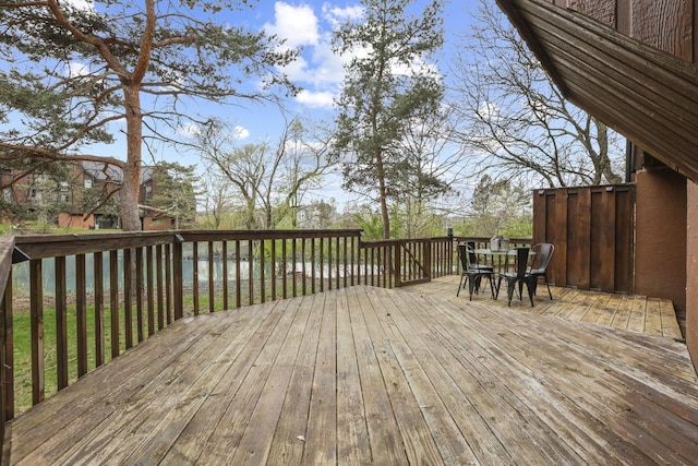 wooden deck featuring outdoor dining space