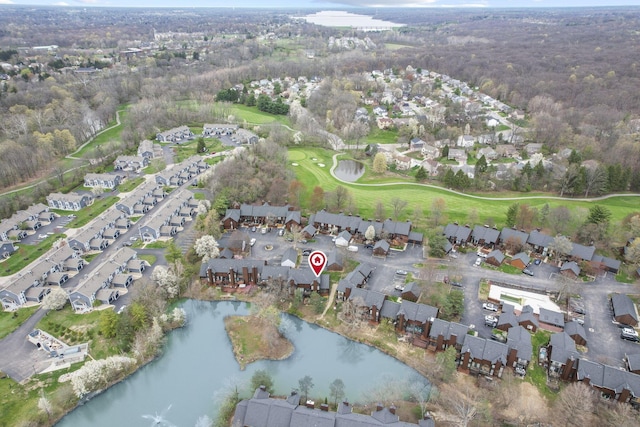 bird's eye view with a residential view, view of golf course, and a water view
