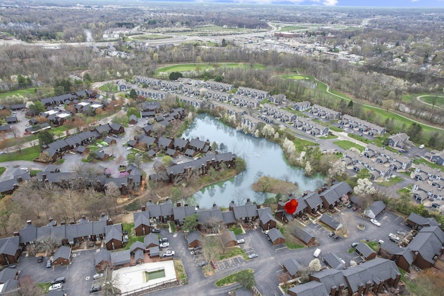 birds eye view of property featuring a water view and a residential view