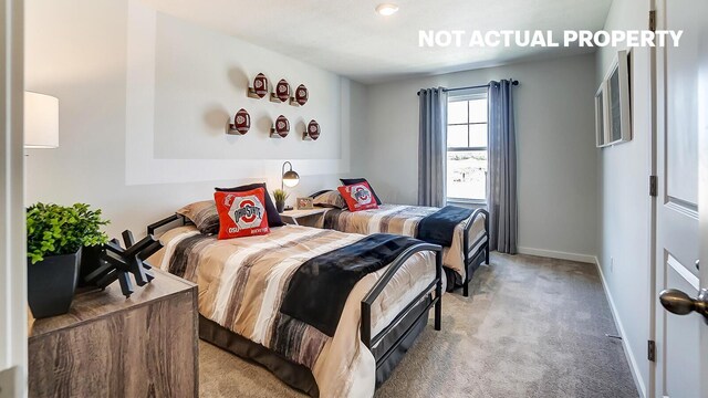 carpeted bedroom featuring baseboards