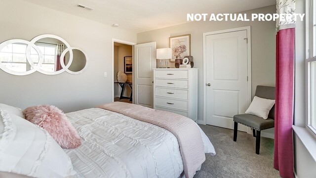 bedroom featuring visible vents and carpet floors