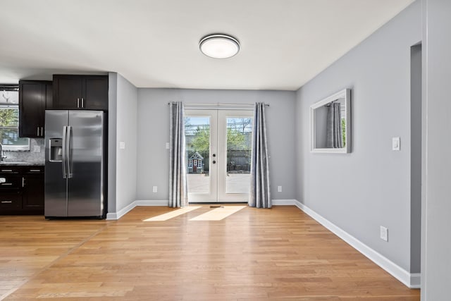 2209 Fishinger Rd, Columbus, OH 43221 - interior space featuring french doors, light wood-style floors, and baseboards