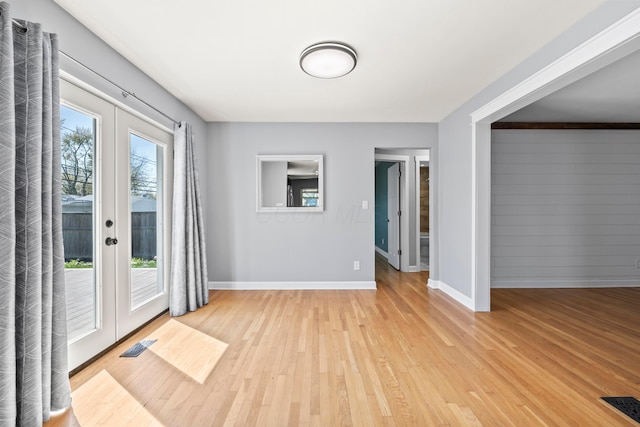 2209 Fishinger Rd, Columbus, OH 43221 - interior space with baseboards, visible vents, french doors, and light wood finished floors