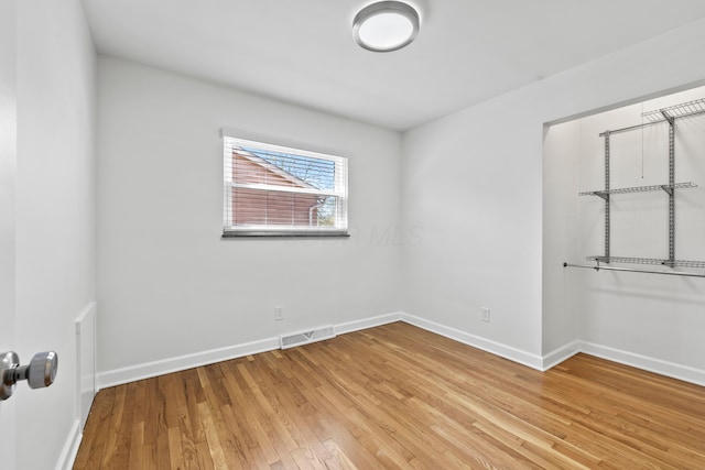 2209 Fishinger Rd, Columbus, OH 43221 - unfurnished room with baseboards, light wood-type flooring, and visible vents