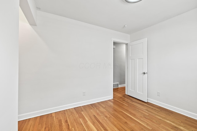 2209 Fishinger Rd, Columbus, OH 43221 - unfurnished room featuring baseboards, light wood-style flooring, and visible vents