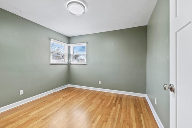 2209 Fishinger Rd, Columbus, OH 43221 - unfurnished room with baseboards and light wood finished floors