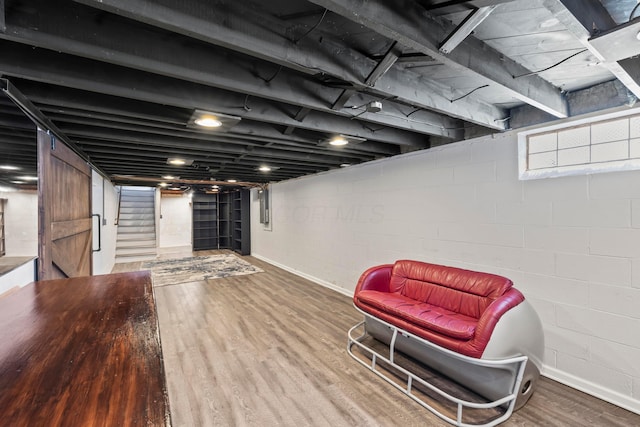2209 Fishinger Rd, Columbus, OH 43221 - basement with baseboards, stairs, and wood finished floors