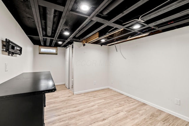 2209 Fishinger Rd, Columbus, OH 43221 - basement featuring light wood-type flooring and baseboards