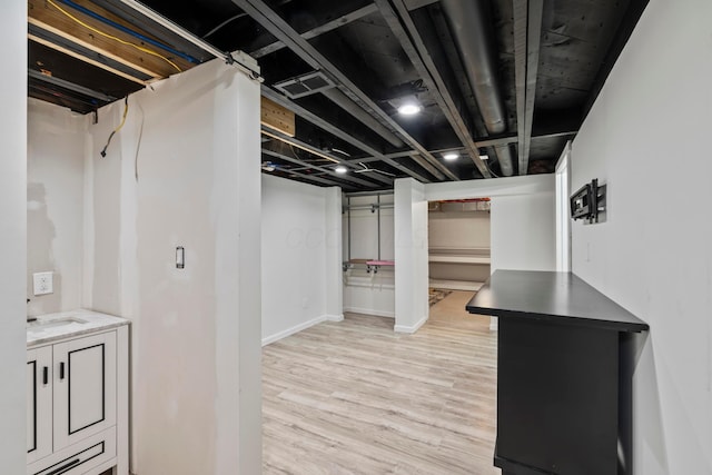 2209 Fishinger Rd, Columbus, OH 43221 - finished basement with light wood-type flooring and baseboards
