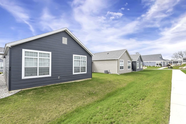 view of property exterior featuring a yard and cooling unit