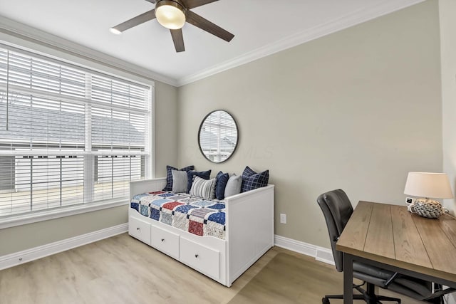 bedroom with light wood finished floors, baseboards, crown molding, and ceiling fan
