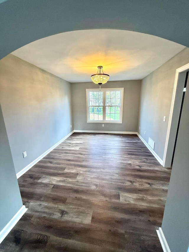 9465 Santa Clara Cir, Plain City, OH 43064 - unfurnished room with dark wood-style flooring, baseboards, and visible vents