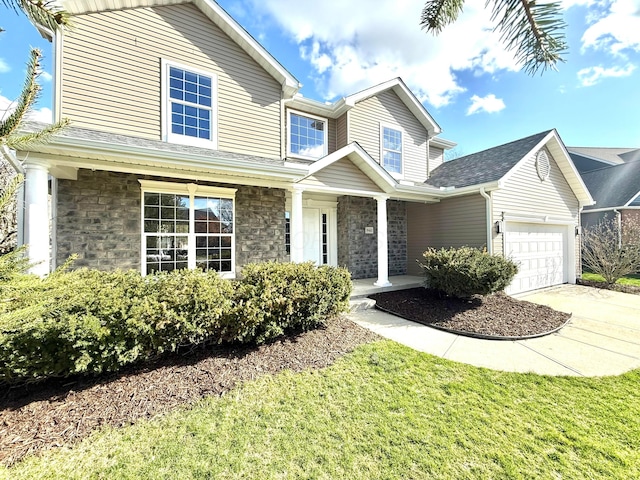 9465 Santa Clara Cir, Plain City, OH 43064 - traditional home featuring covered porch, an attached garage, driveway, and stone siding