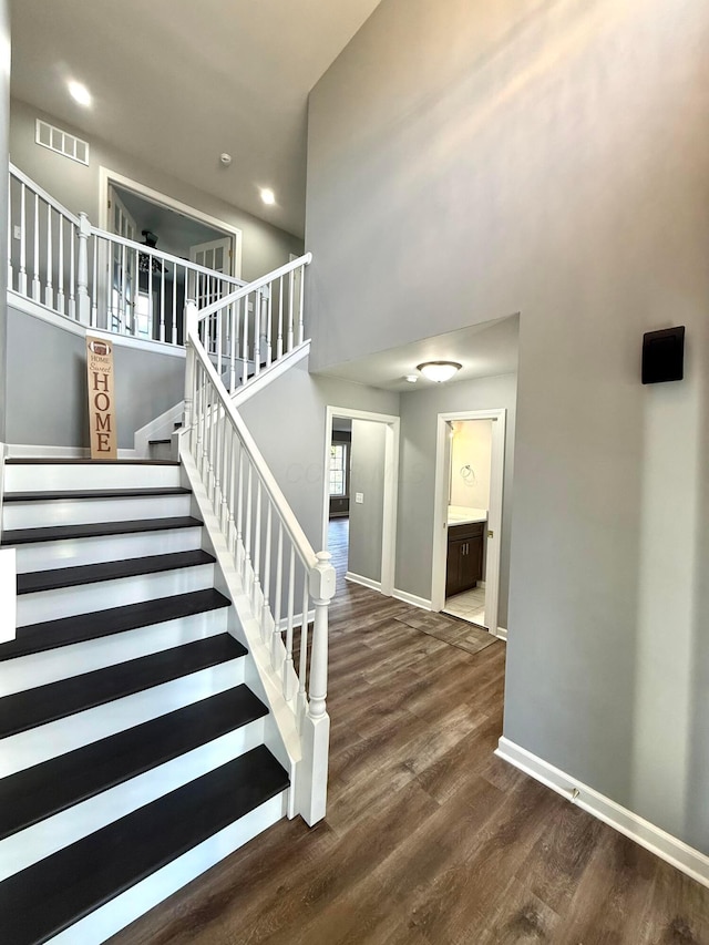 9465 Santa Clara Cir, Plain City, OH 43064 - stairs featuring baseboards, a high ceiling, wood finished floors, and visible vents