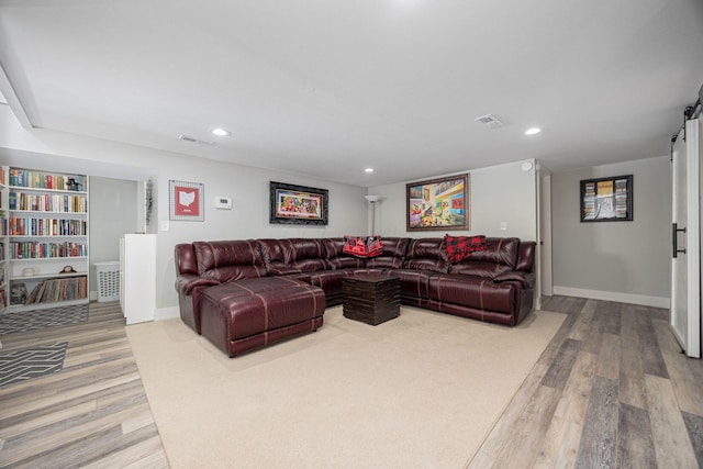 living area featuring wood finished floors, visible vents, and recessed lighting