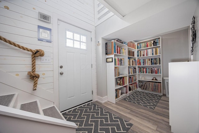 foyer entrance featuring wood finished floors