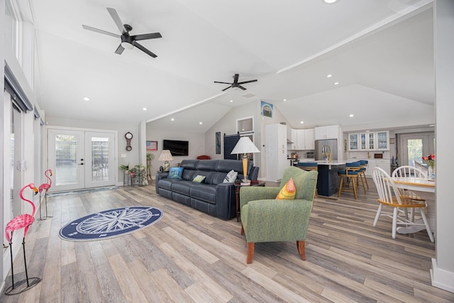 living room featuring a healthy amount of sunlight, recessed lighting, ceiling fan, and vaulted ceiling