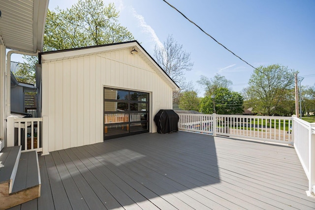 wooden deck with grilling area