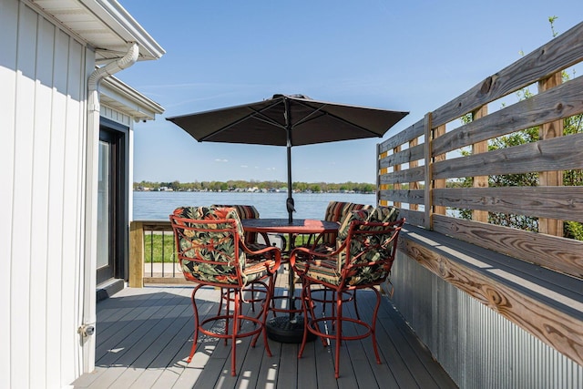 wooden deck featuring a water view