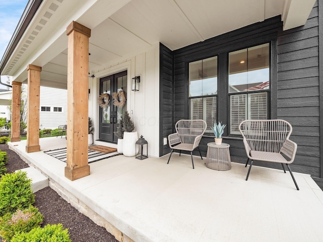 view of patio / terrace with a porch and french doors