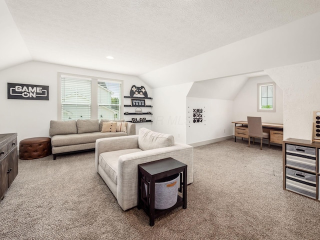 carpeted living room with vaulted ceiling