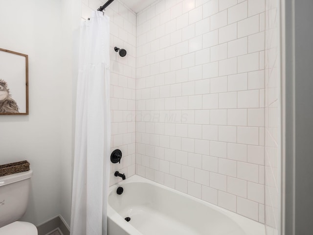 bathroom with toilet and shower / bath combination with curtain