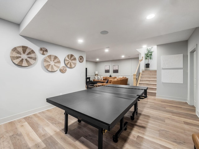 game room featuring baseboards, recessed lighting, and light wood-style flooring