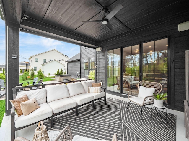view of patio featuring a ceiling fan and outdoor lounge area