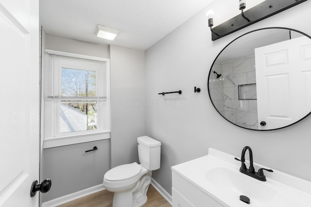 271 S Terrace Ave, Columbus, OH 43204 - bathroom featuring vanity, baseboards, toilet, a shower, and wood finished floors