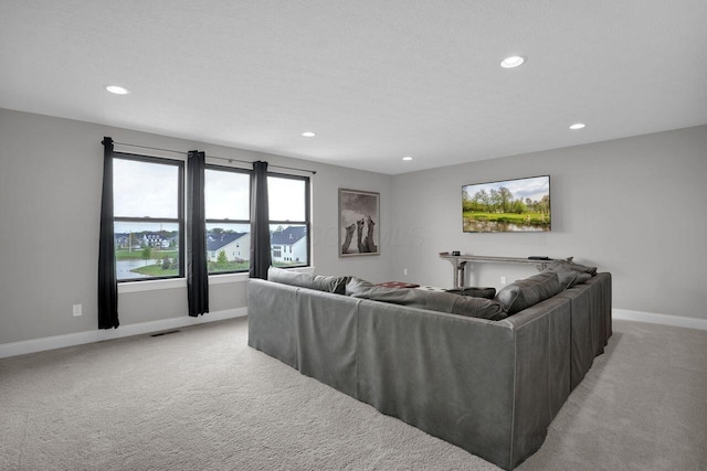 living room with light colored carpet, baseboards, and recessed lighting