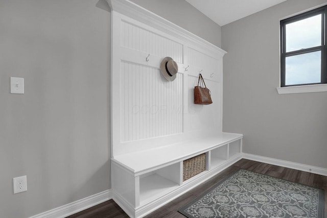 mudroom with baseboards, visible vents, and dark wood finished floors