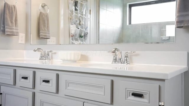 bathroom featuring double vanity and a sink